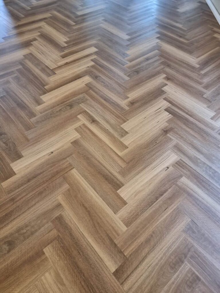 BGH702 QLD SPOTTED GUM HERRINGBONE 8MM WATERPROOF HYBRID SPC